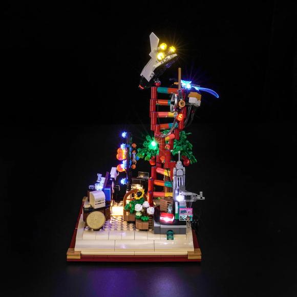 Oplyst LEGO Ideas 21355 Naturvidenskabens udvikling med BrickBling set direkte fra siden mod venstre