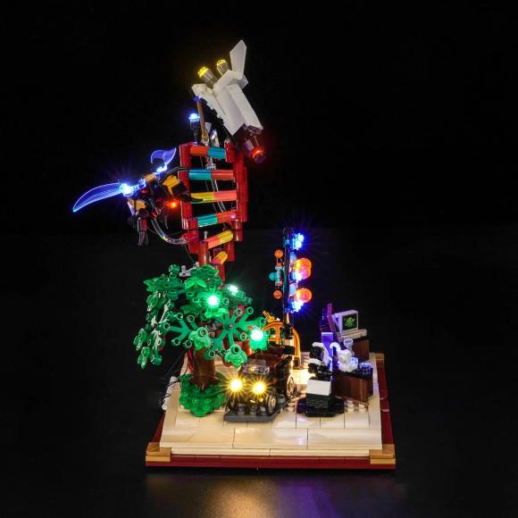 Oplyst LEGO Ideas 21355 Naturvidenskabens udvikling med BrickBling set direkte fra siden mod højre 